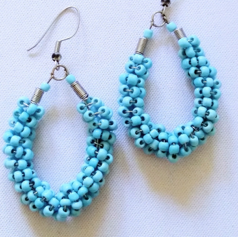 Turquoise blue mini bead earrings dangle.